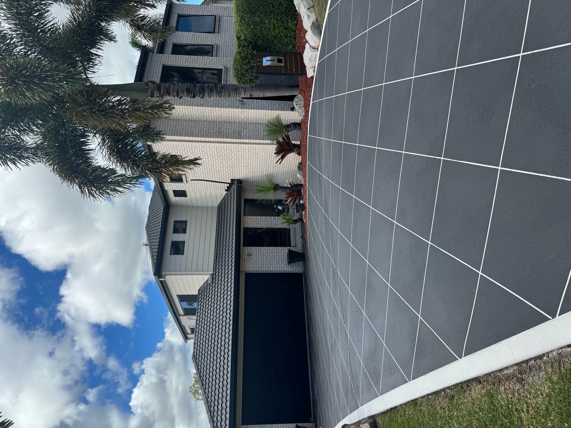 Driveway after covercrete resurfacing - Midnight Blue colour with white stencil finish