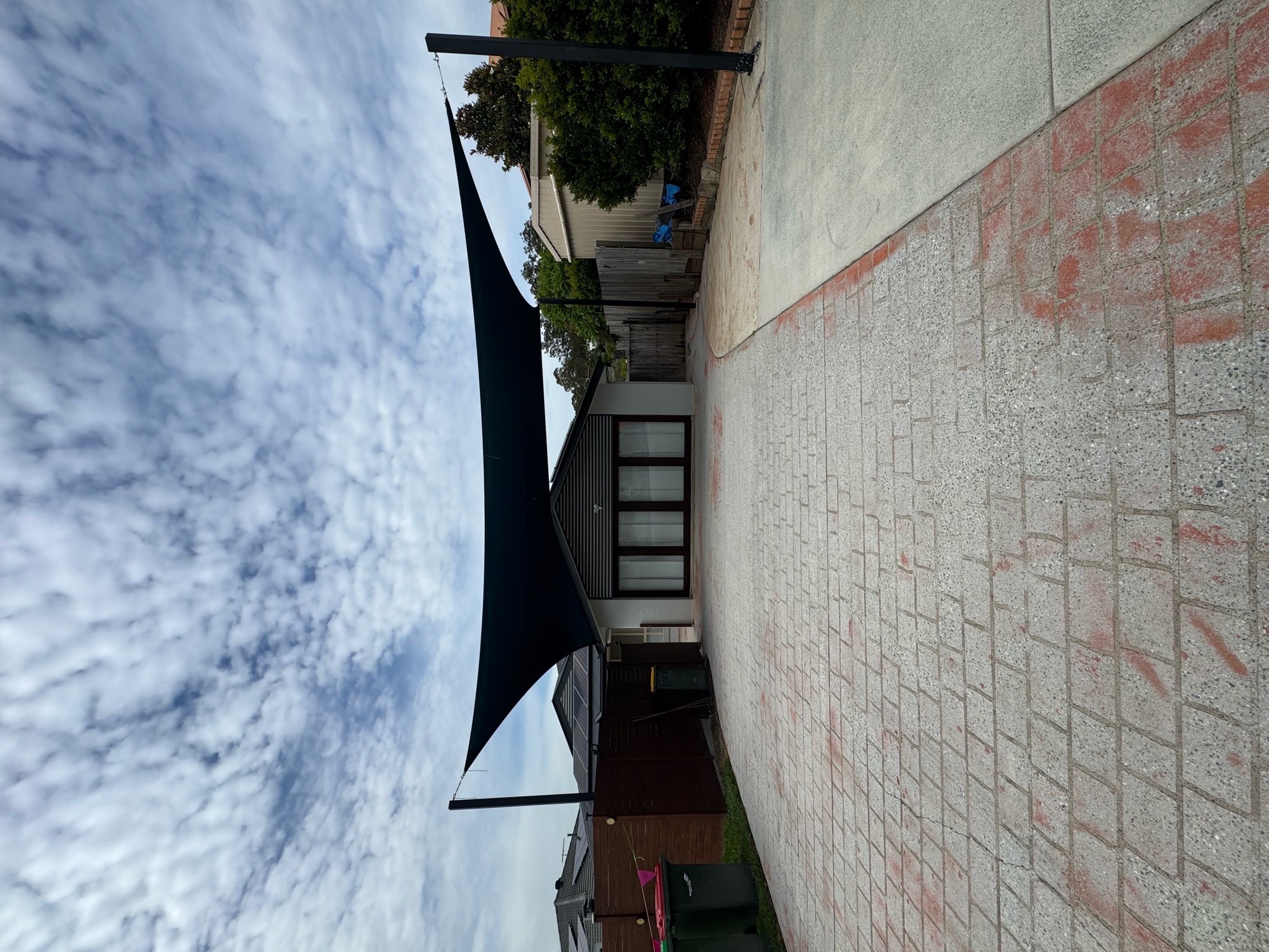 Driveway before covercrete resurfacing in Atlantic with black and white fleck